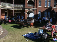 The picnic rugs are spread on the beautiful lawn of the old Governor General's Strathfield mansion.